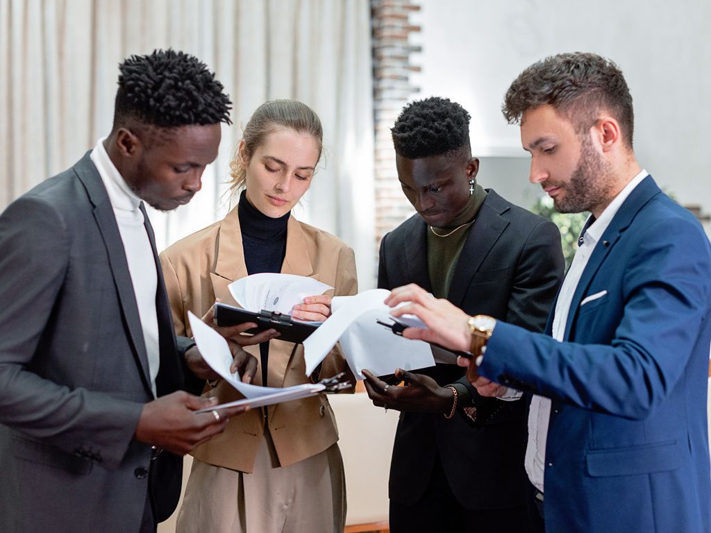 A management team reviewing business information together