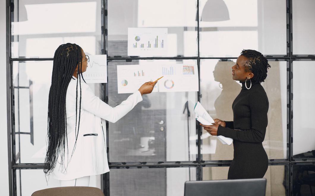 Advisers reviewing performance data with a client team