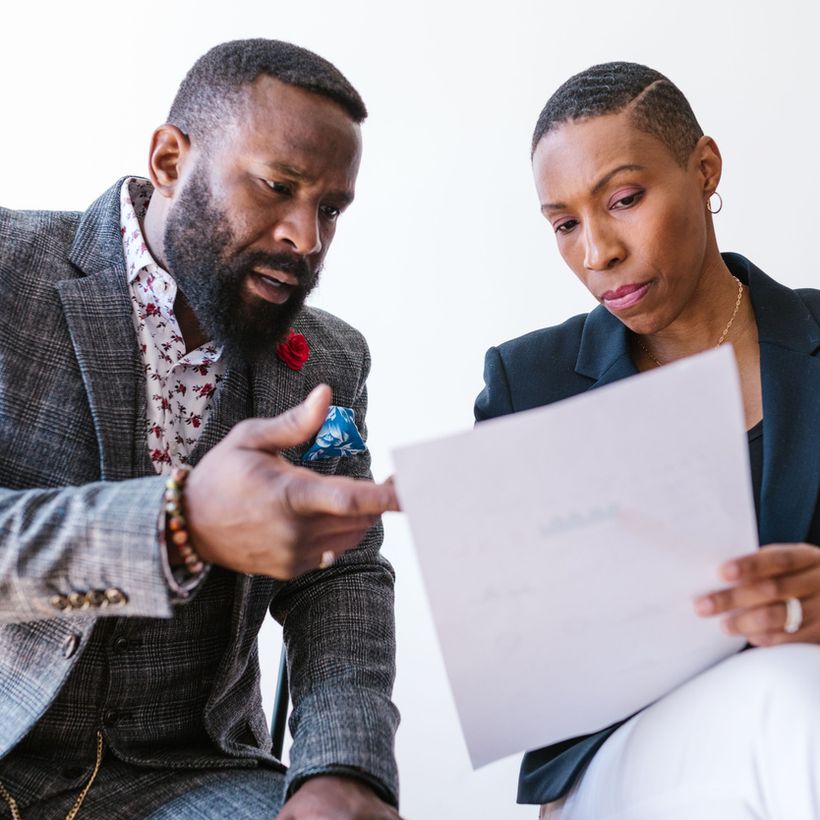 Advisers working through business information with a client